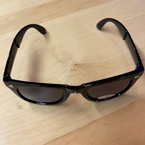Black foldable sunglasses.